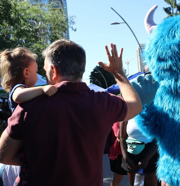 Community members at Burnaby Neighbourhood Housing, from the official BNH website.